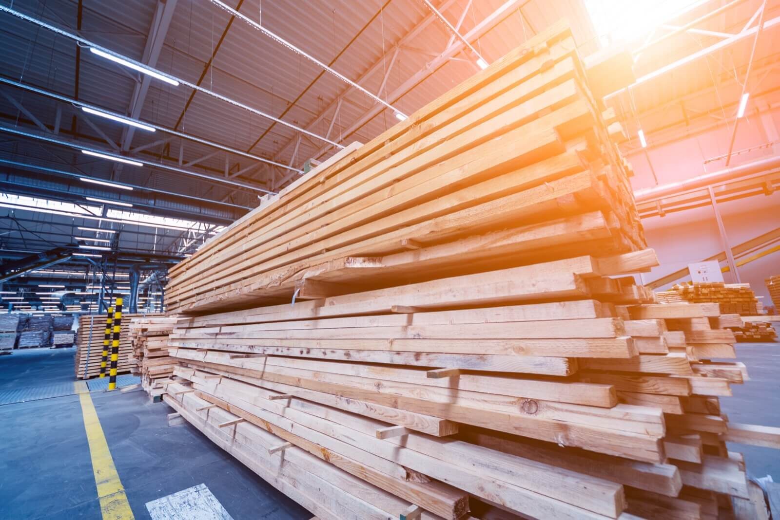 Stacked lumber inside a warehouse